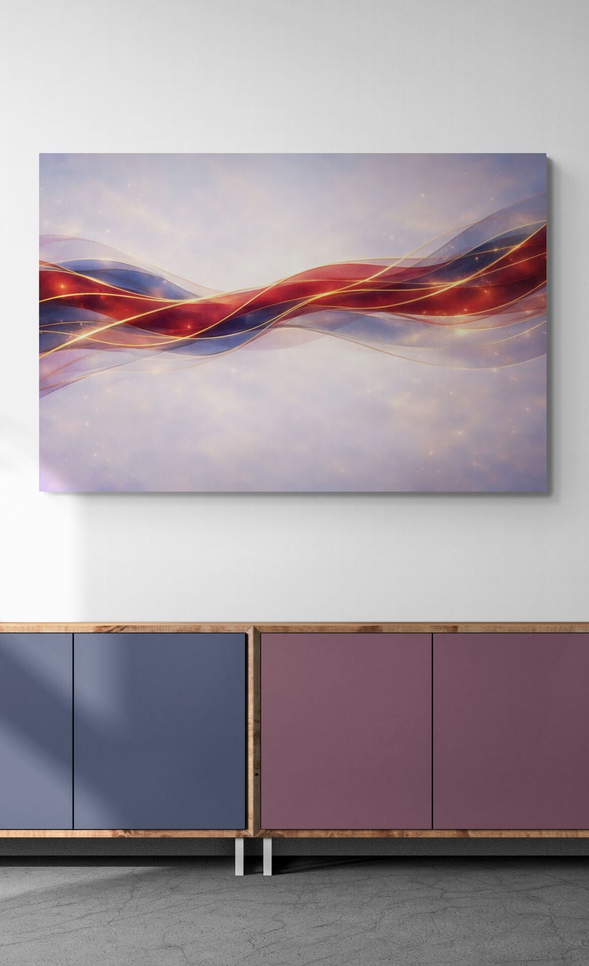 Abstract painting with wavy lines in red, blue, and purple on a white wall above a modern cabinet.