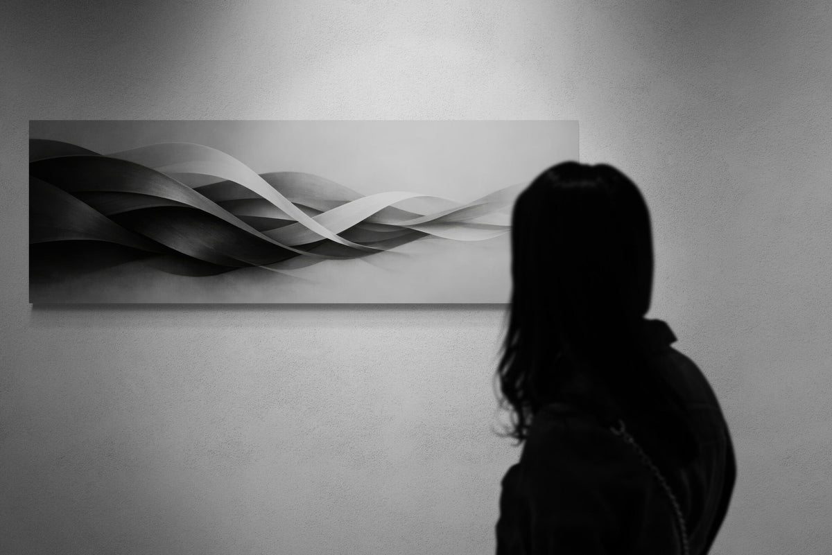 Person standing in front of a wall with a large abstract painting