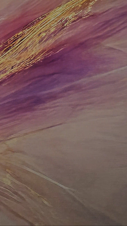 Close-up of a textured fabric with a gradient of colors.
