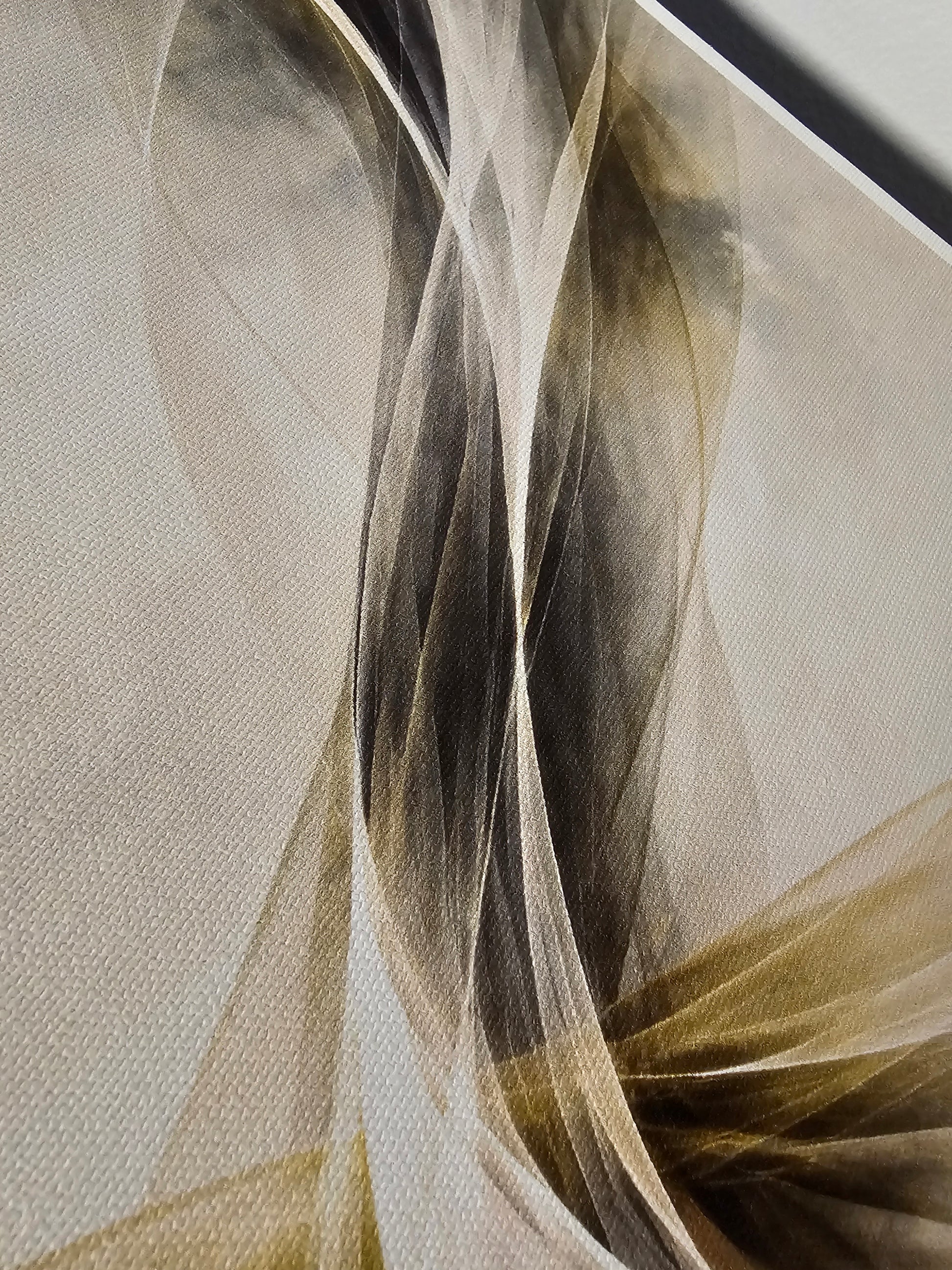 Close-up of a textured fabric with wavy patterns in beige, brown, and gray.