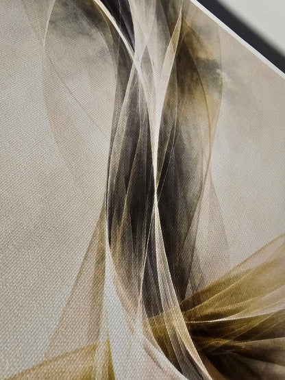 Close-up of a textured fabric with wavy patterns in beige, brown, and gray.