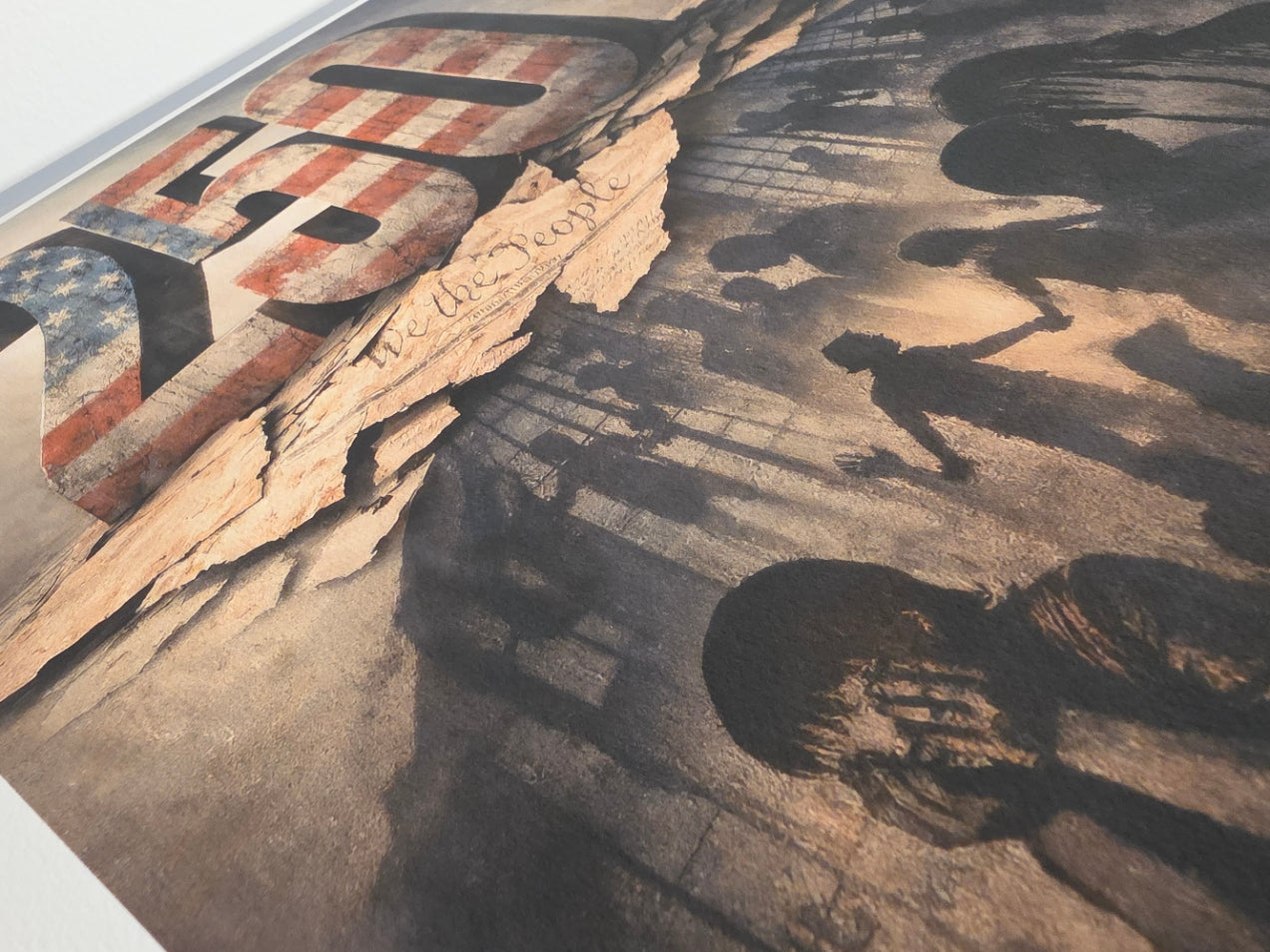 Abstract art piece with shadows of hands and a distressed American flag.