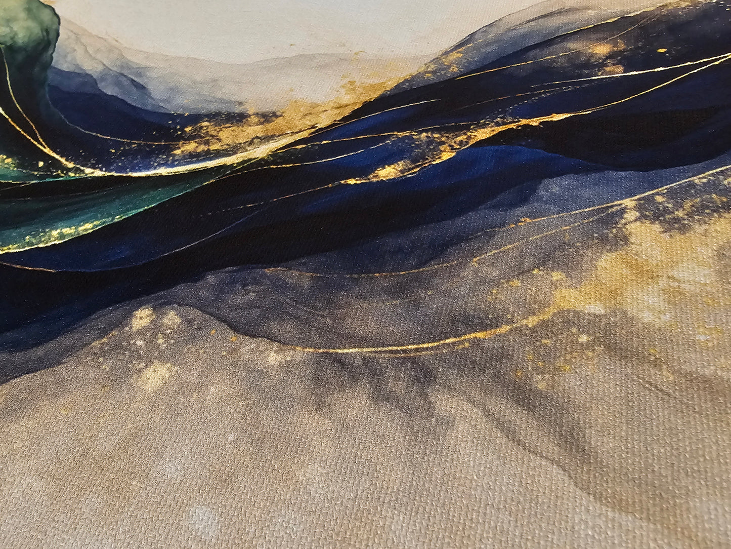 Abstract art with wavy lines in blue, gold, and gray on a textured surface