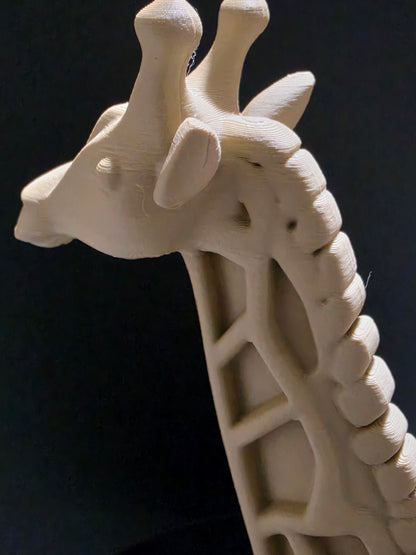 Close-up of a 3D-printed model of a human spine on a black background