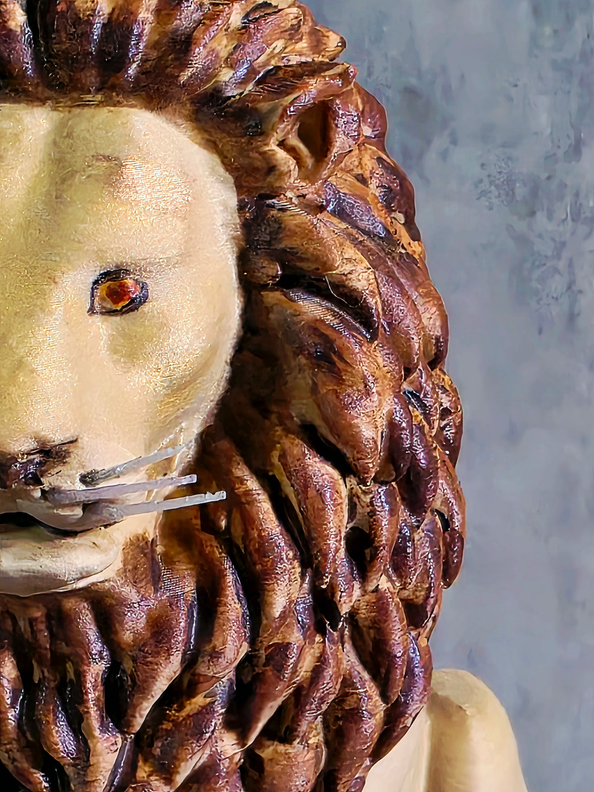 Seated Lion with a a painted main sculpture