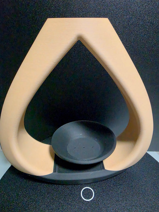 Beige and black vase with a tea candle/incense holder