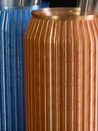 Close-up of a copper coil with a blue background