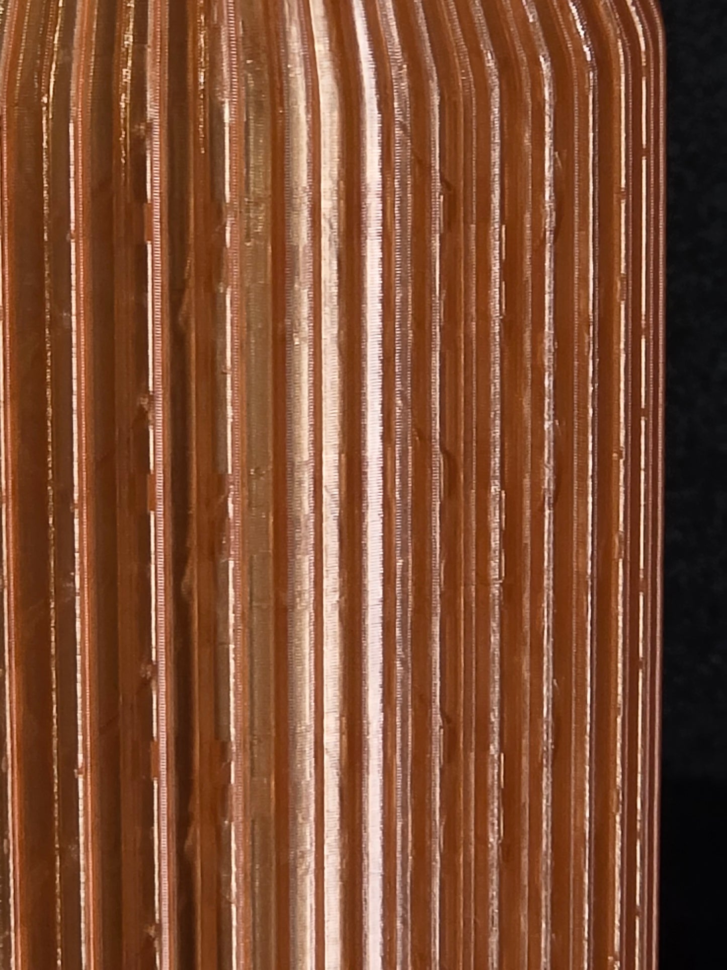 Close-up of a corrugated cardboard box with a dark background