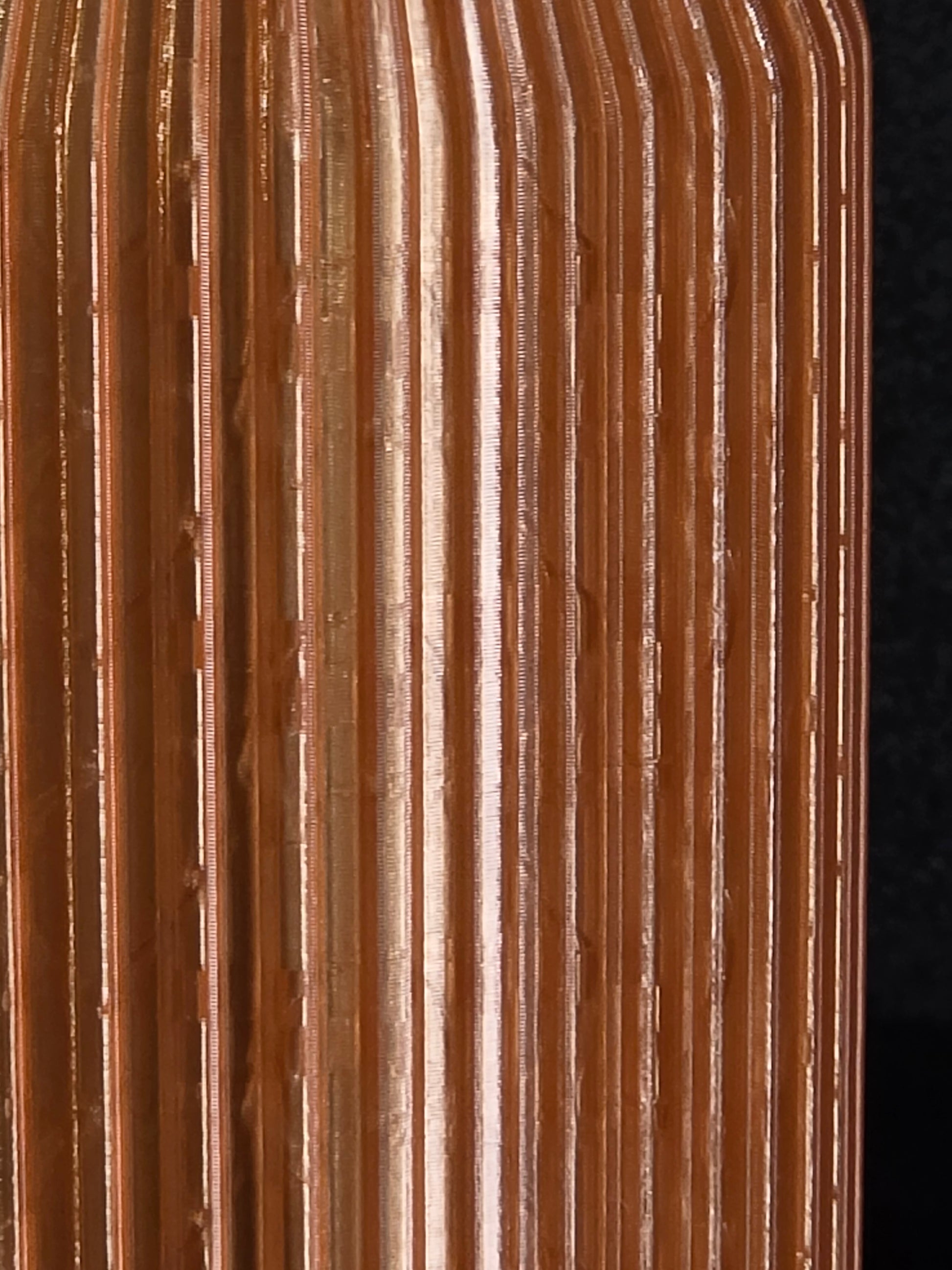 Close-up of a corrugated cardboard box with a dark background