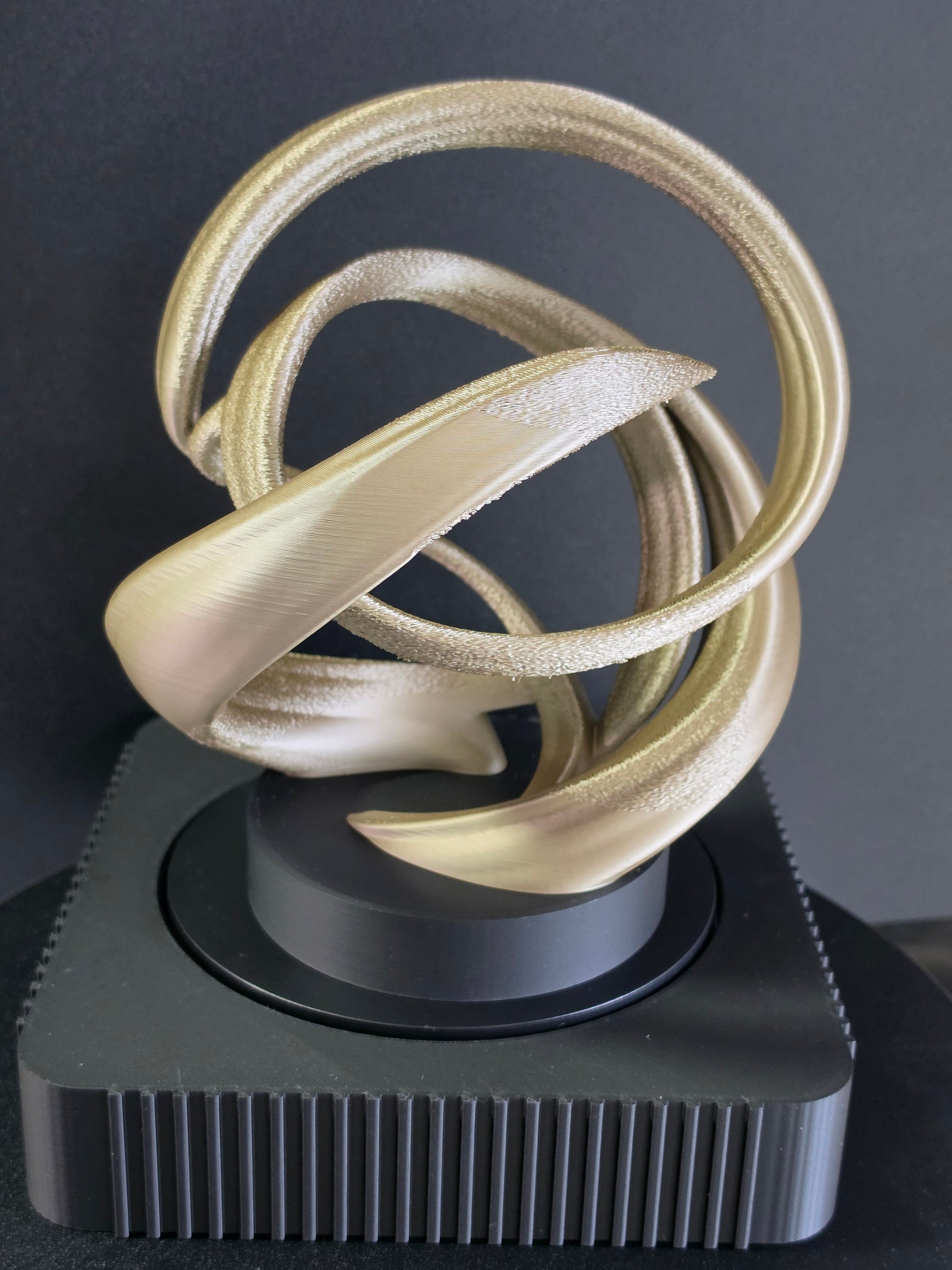 Square Rotating Art Display with Gold Sculpture