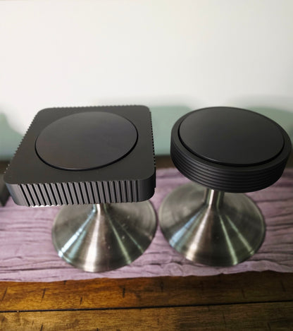 Square and Round Rotating Art displays on pedestals
