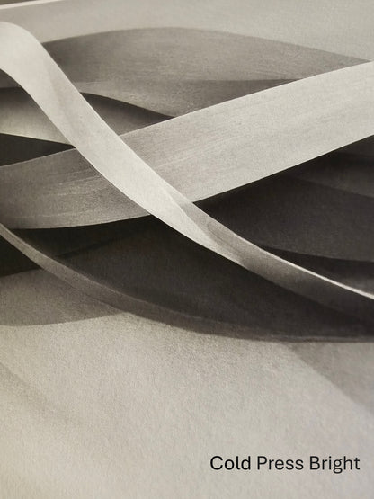 Abstract art with wavy lines on a textured surface, labeled 'Cold Press Bright'.