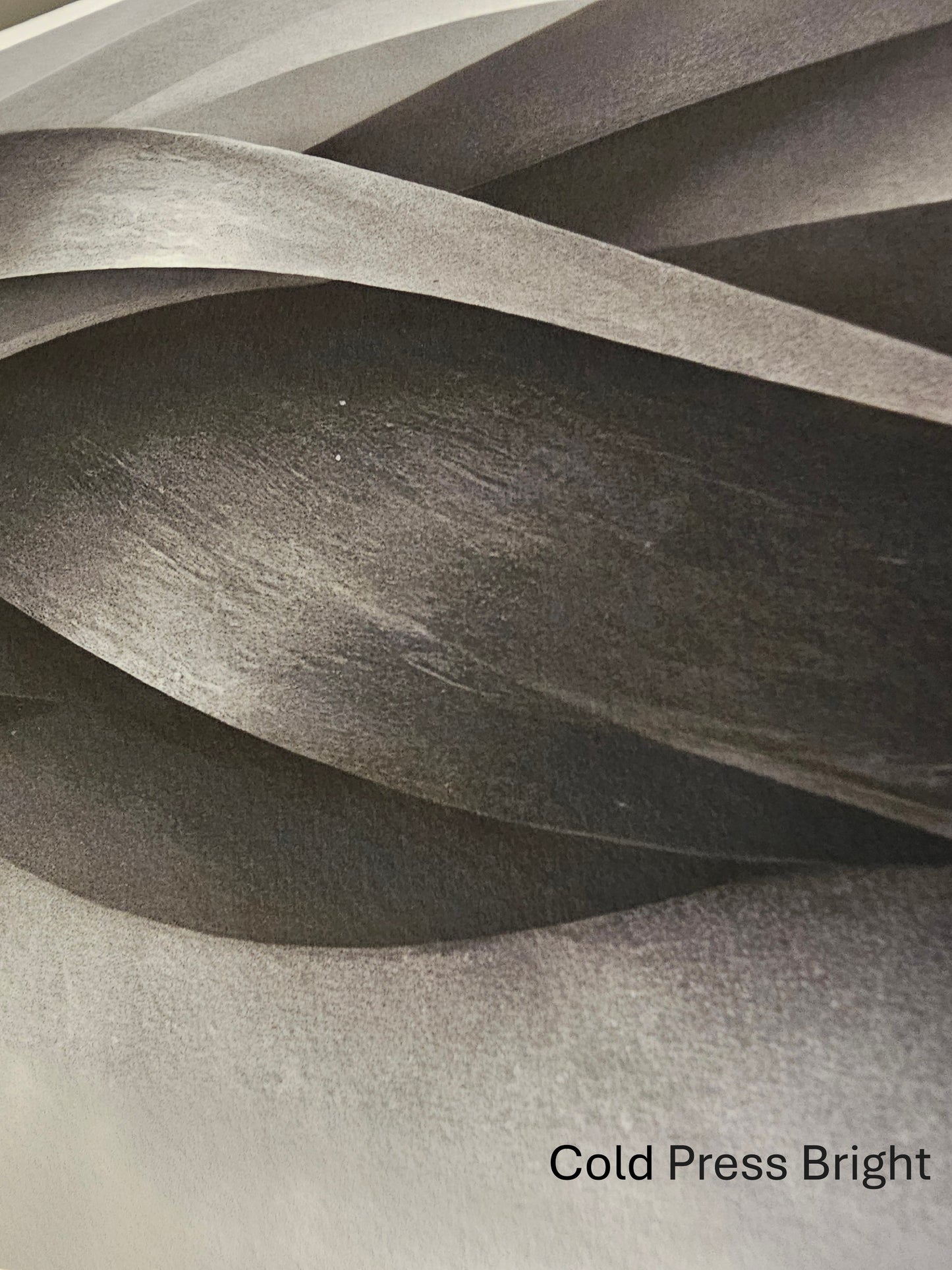 Textured paper with wavy layers and 'Cold Press Bright' label
