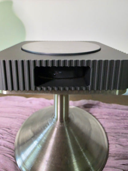 Square Rotating Art displays on pedestal
