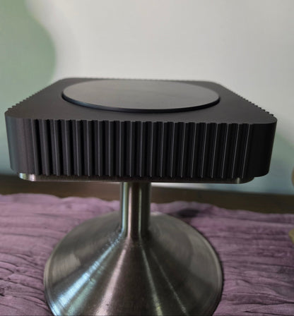 Square Rotating Art displays on pedestal