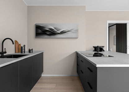 Modern kitchen with black cabinets, white countertops, and abstract wall art.