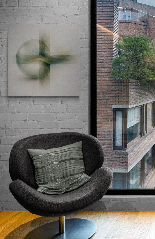 Modern chair with a pillow in front of a window with a view of a building.