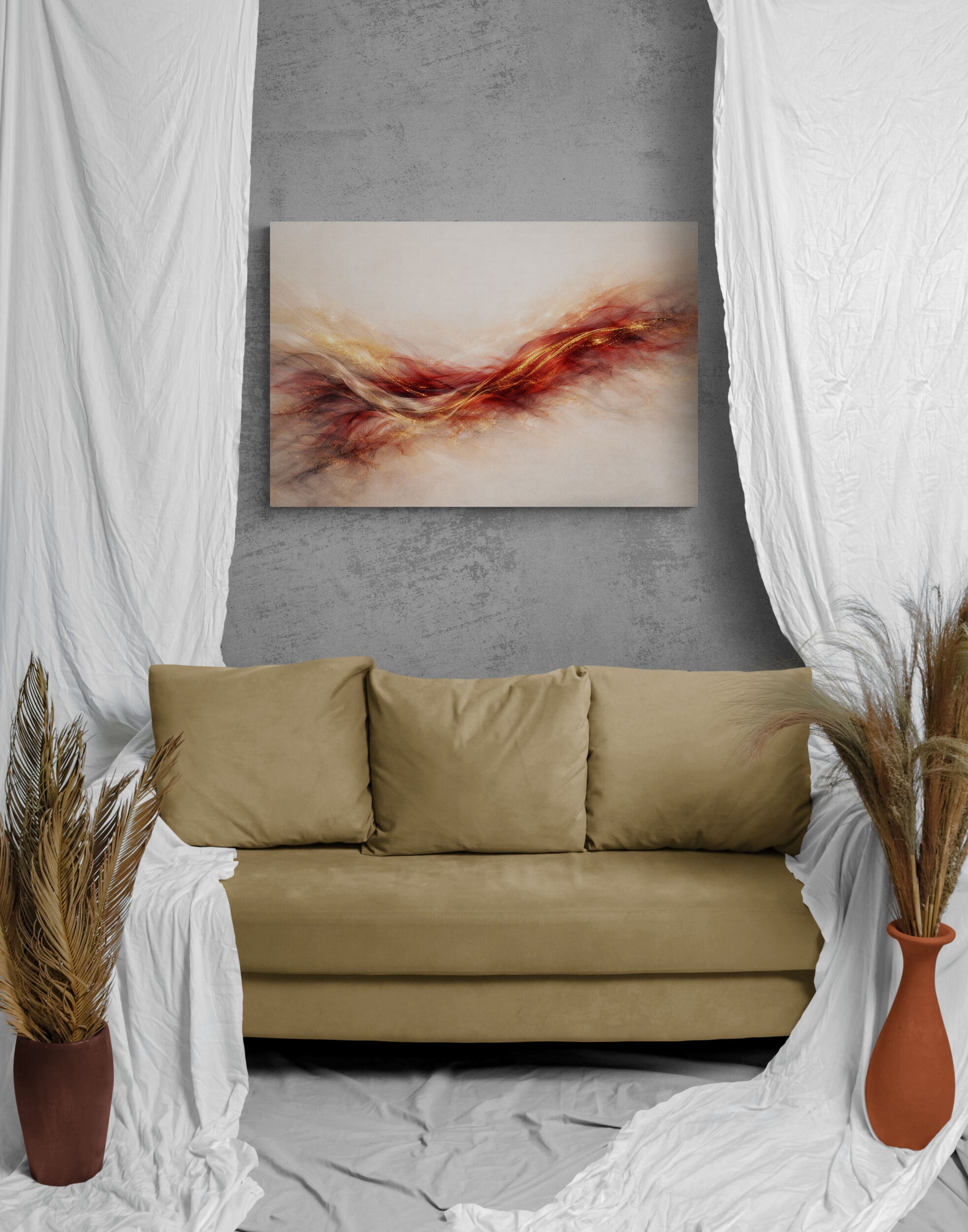 Beige sofa in a room with abstract art on the wall, white curtains, and decorative plants.