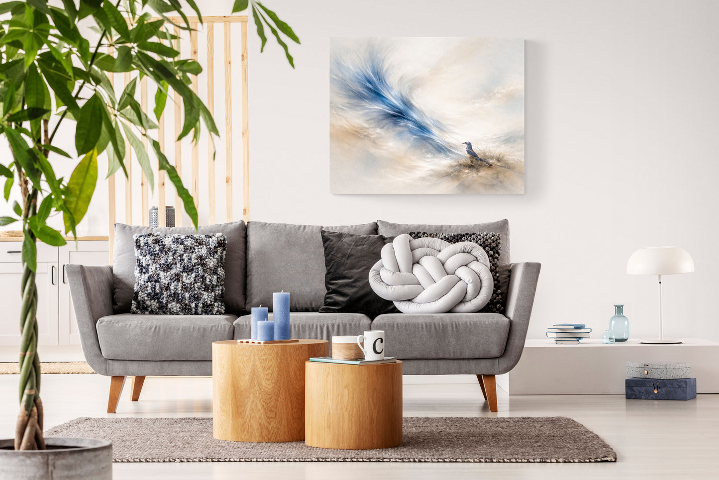 Modern living room with gray sofa, wooden coffee table, and decorative wall art.
