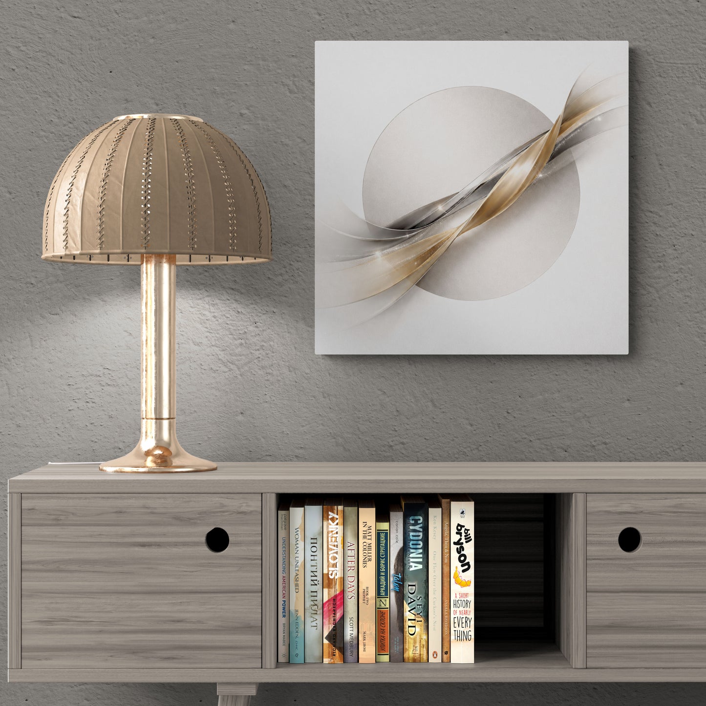 Modern interior with a lamp, books, and abstract wall art on a gray wall.