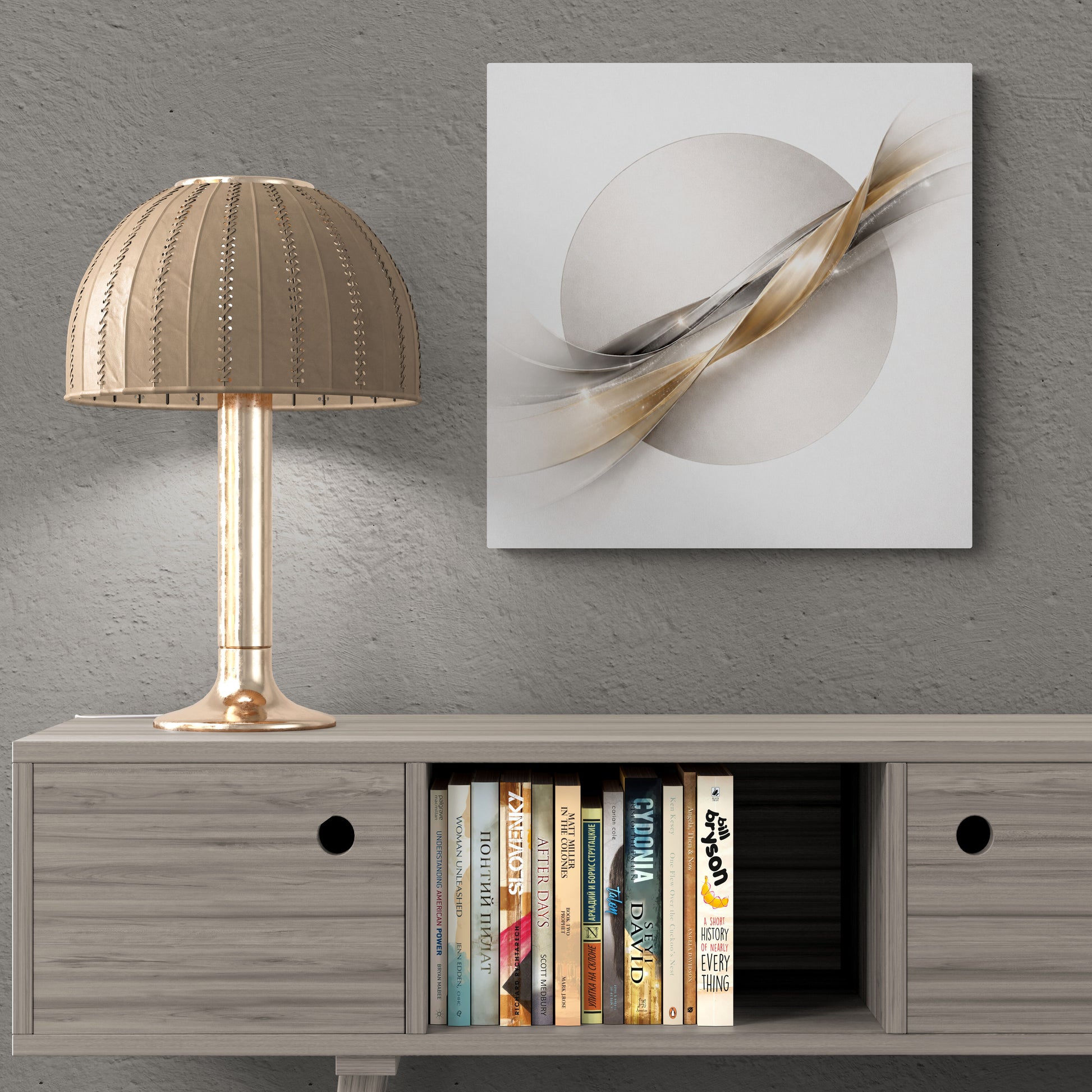Modern interior with a lamp, books, and abstract wall art on a gray wall.