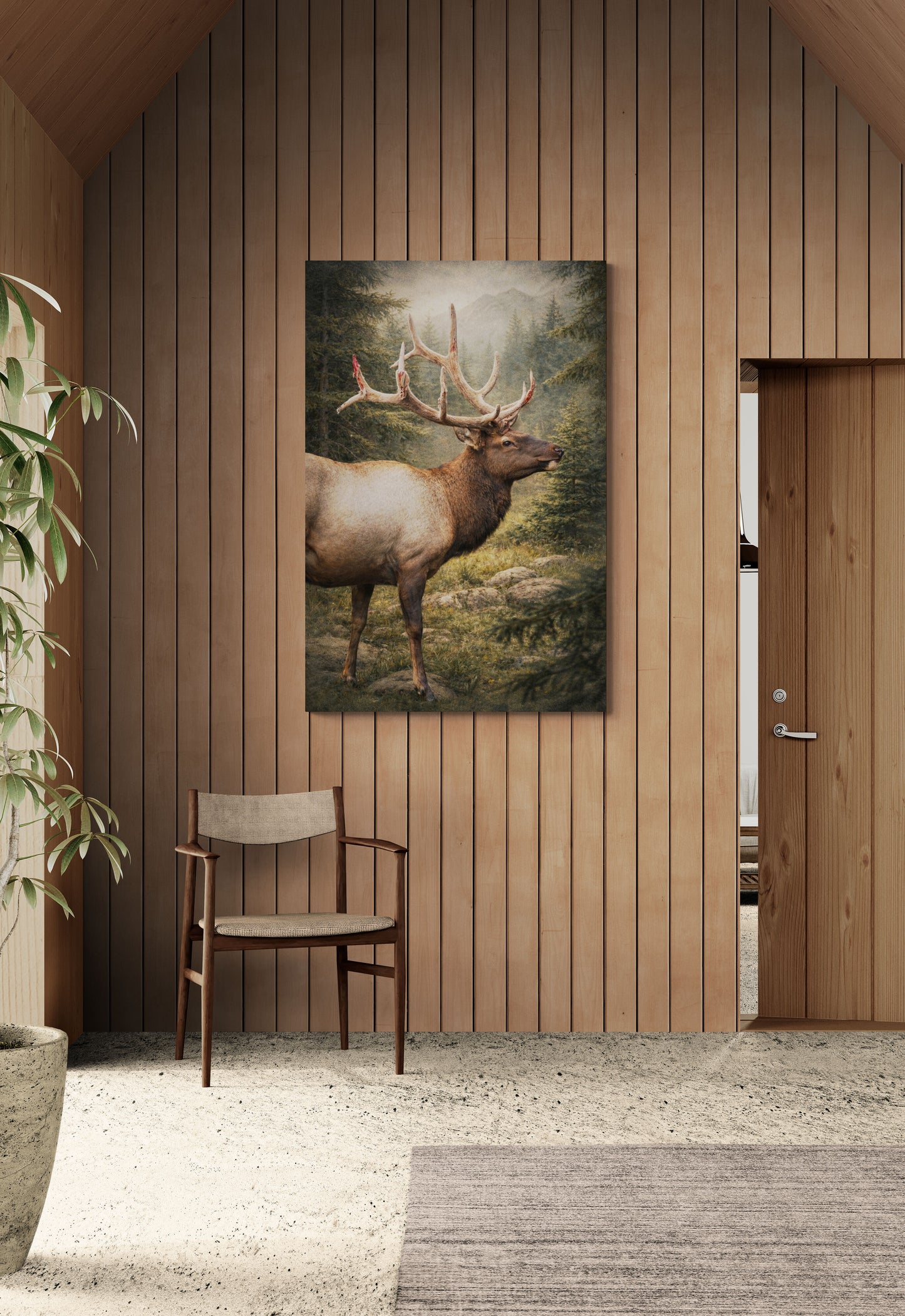 Room with wooden walls, a chair, and a painting of a deer on the wall.