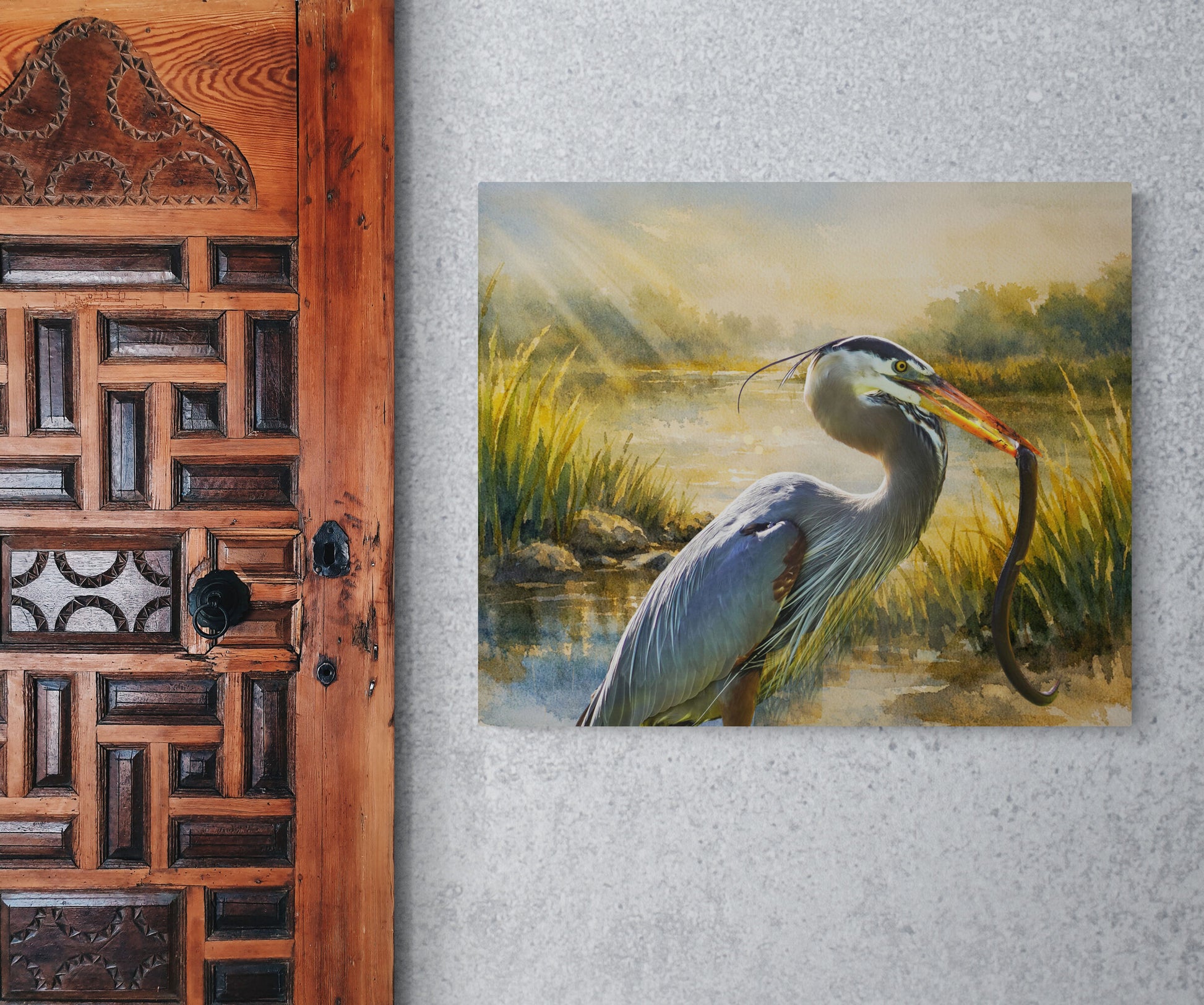 Painting of a heron holding a snake on a textured wall next to a wooden door.