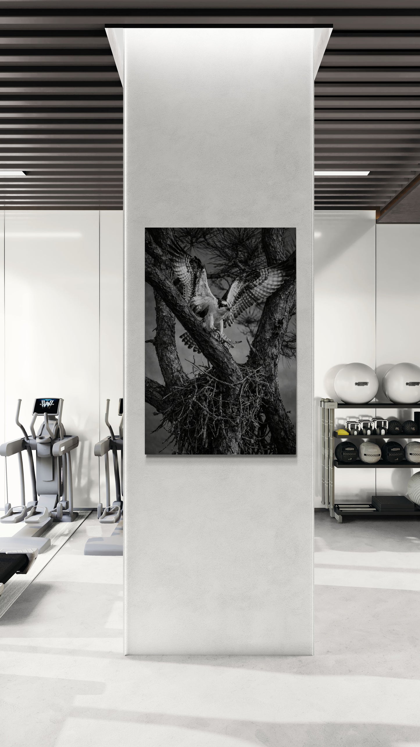 Modern interior with a black and white abstract artwork on a white wall.