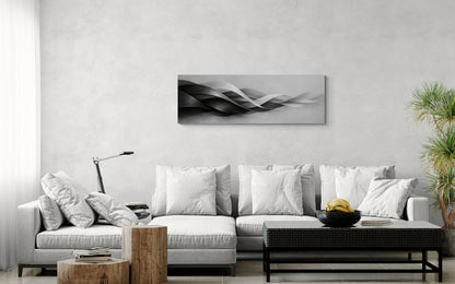Modern living room with a white sofa, coffee table, and decorative wall art.