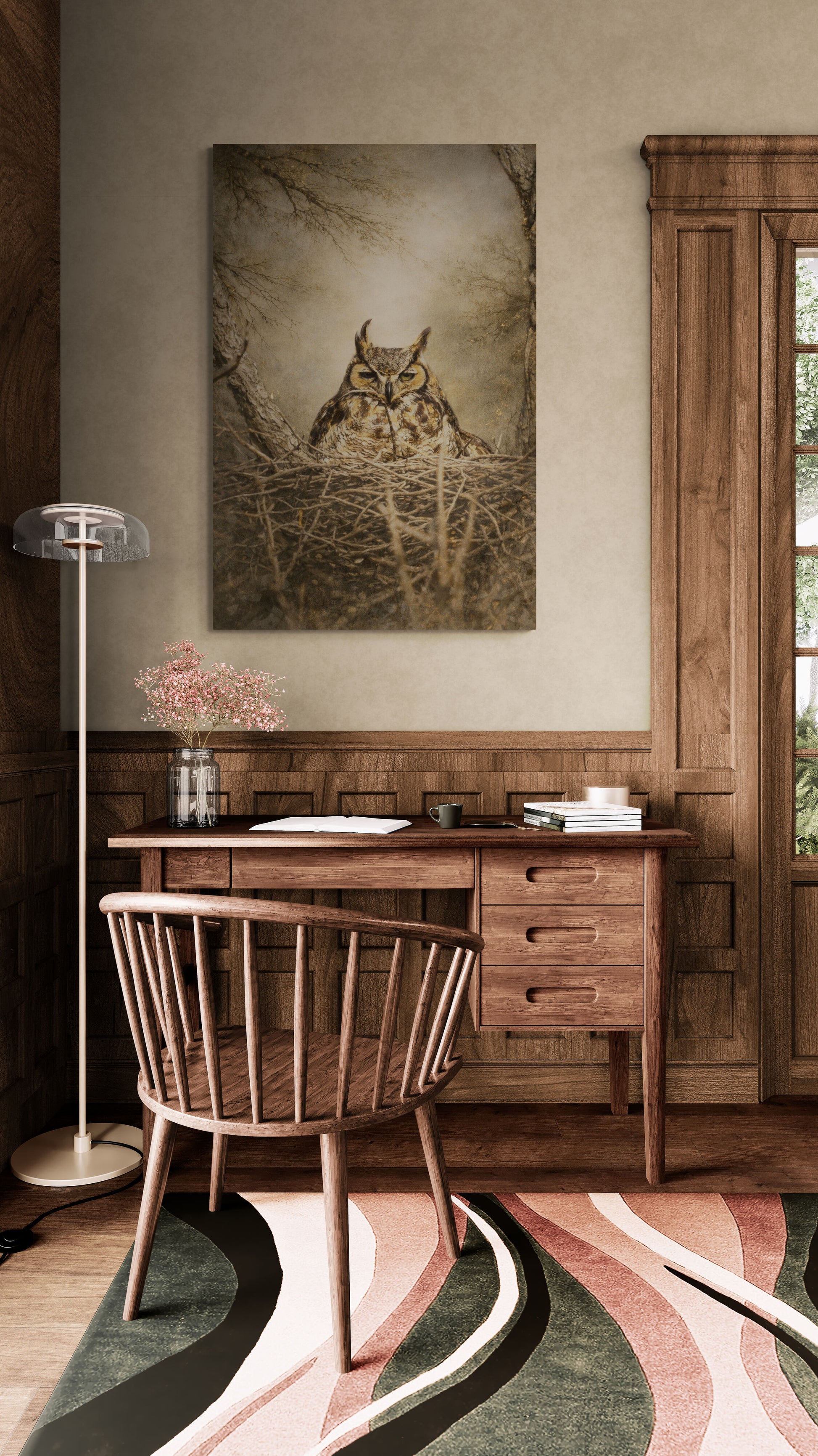 Wooden desk with chair in a room with a painting of an owl on the wall.