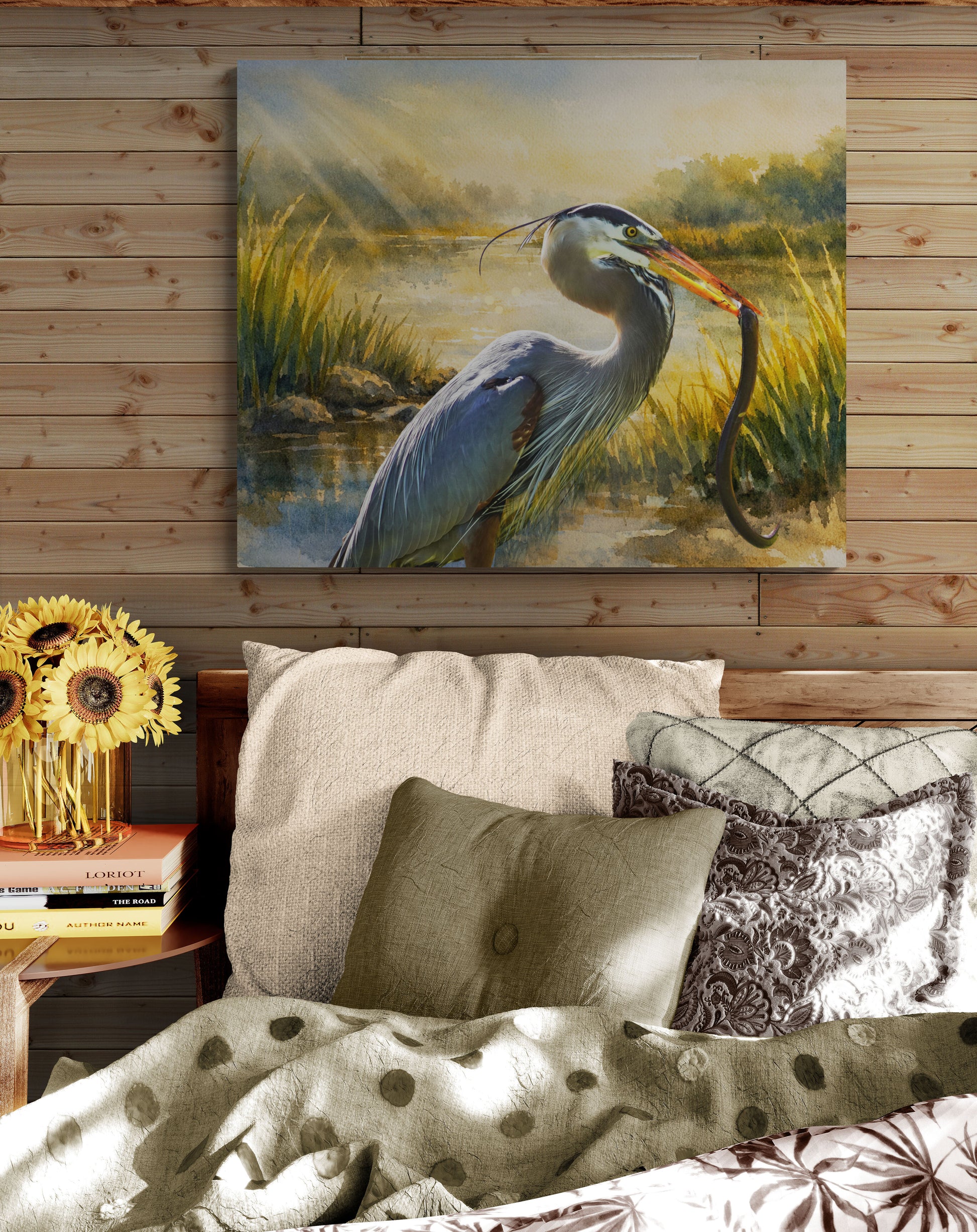 Painting of a heron on a wooden wall above a sofa with decorative pillows.